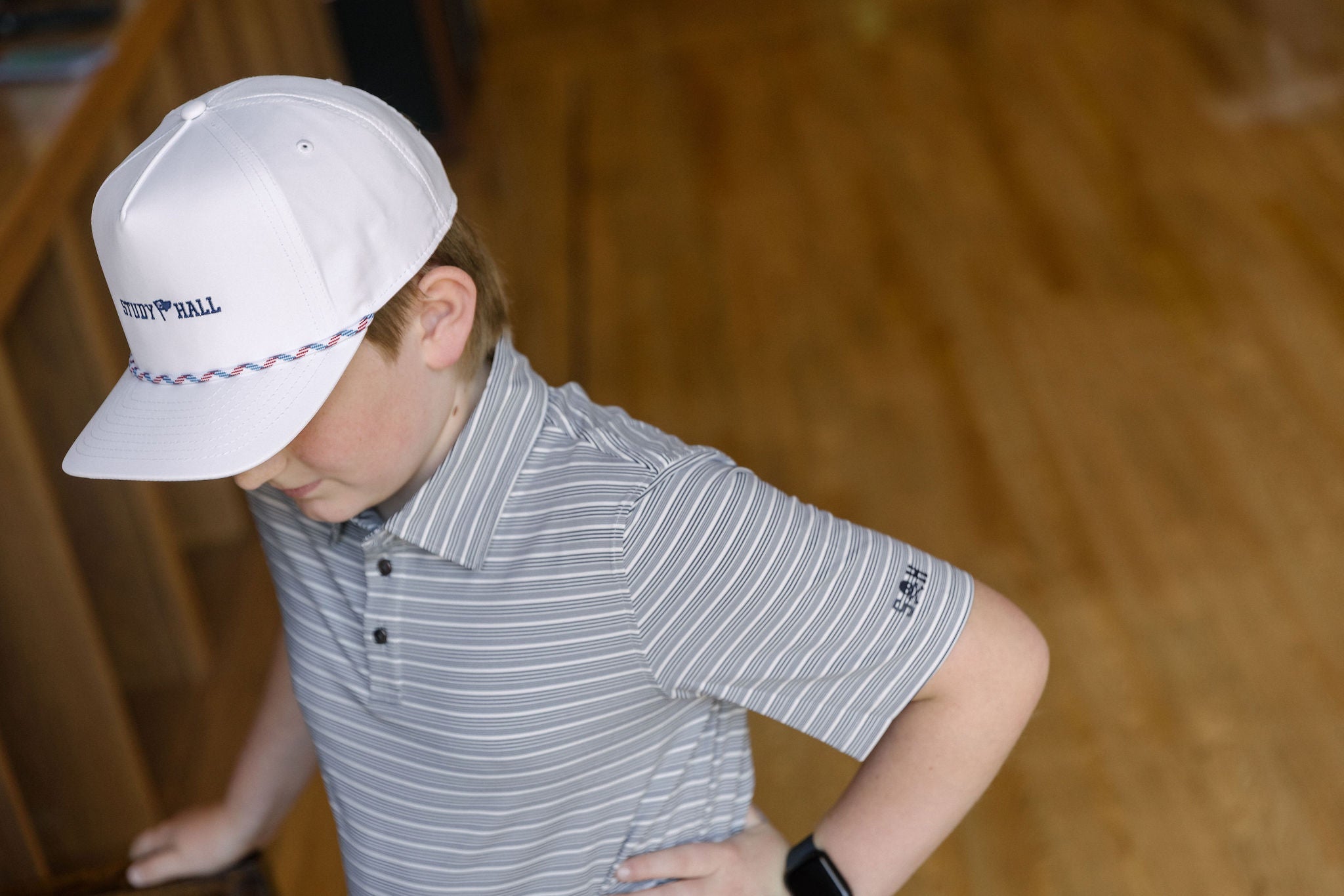 Child wearing a white cap and striped shirt